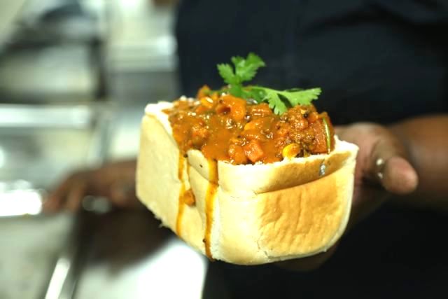 A bite of bunny chow